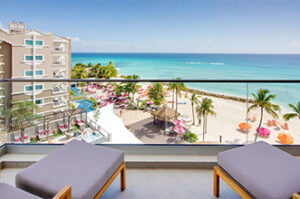 O2 Beach Club & Spa veranda with beach and pool view